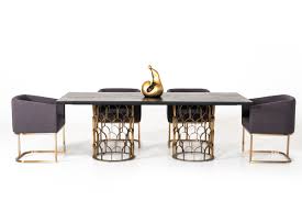 A geometric base is constructed of beautiful brushed metal. Modrest Natalie Modern Black Acacia Antique Brass Dining Table Dining Tables Dining