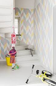 Kira Wallpaper A Radiant Geometric Wallpaper Featuring Large Scale Chevrons In Duck Egg Wallpaper Pink And Yellow Scandinavian Wallpaper Childrens Interiors