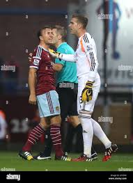 West Ham United's Mark Noble, left tells his goalkeeper Adrian to use his  head following a clash with Liverpool's Mario Balotelli (out of picture  Stock Photo