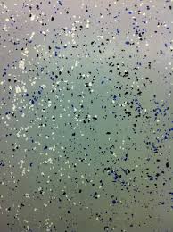 Close Up Of Epoxy Overlay On A Concrete Floor With Colored Paint Chips In Light Broadcast Concrete Floors Finishing Basement Commercial Flooring