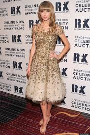 Maybe the swooping gold detailing on the dress was a good omen. Taylor Swift Glitters In Gold Prom Dress For Hope Gala Huffpost Uk