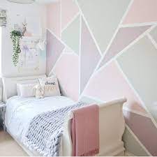 Long the domain of little girls' bedrooms, pink is a color more versatile than many would think. Gorgeous Pink Bedroom For A Little Girl With A Pink Purple And Grey Geometric Feature Wall Feature Wall Bedroom Girls Room Paint Bedroom Wall Designs
