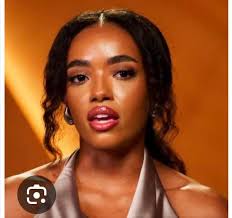 Is the woman in the photo beautiful or not?