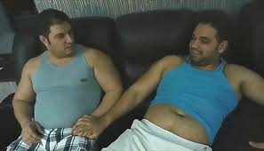 oac47 — (tickle your friends belly button) Two men with...