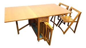 If the leaf is supported by legs that swing out from the center. Vintage Mid Century Modern Drop Leaf Table With Chairs And Storage Set Chairish