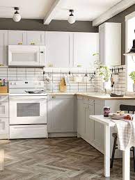 My question is how to insure the cabinets are will be the same height since hardwood floors will be installed under the dishwasher and the oven. Considering An Ikea Kitchen Remodel Bob Vila