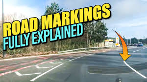 Hatched road markings are used to separate traffic lanes and to make it safer for the vehicles turning right. Road Markings Fully Explained Driving Lesson On Road Markings Youtube