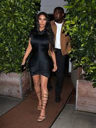 The second picture shows the couple as they walk back down the aisle, kardashian, 33, glowing in her white givenchy gown, with kanye holding her hand a third picture shows kardashian's wedding dress from the back and that luxurious trail. Kim Kardashian Celebrates 5th Wedding Anniversary With Kanye West In Sexy Black Dress Entertainment Tonight