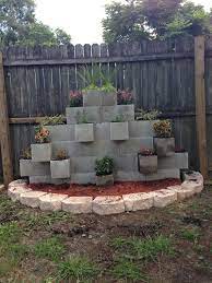 A long time ago, a person tried to be creative and started using cinder blocks as vases for flowers. Pin By Slobodanka Tesic On Garden Cinder Block Garden Cinder Block Garden Wall Cinder Block Walls