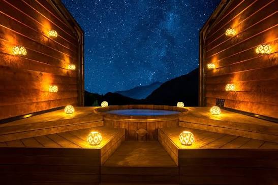 Private cedar hot tubs at Onsen Hot Pools overlooking Shotover Canyon.