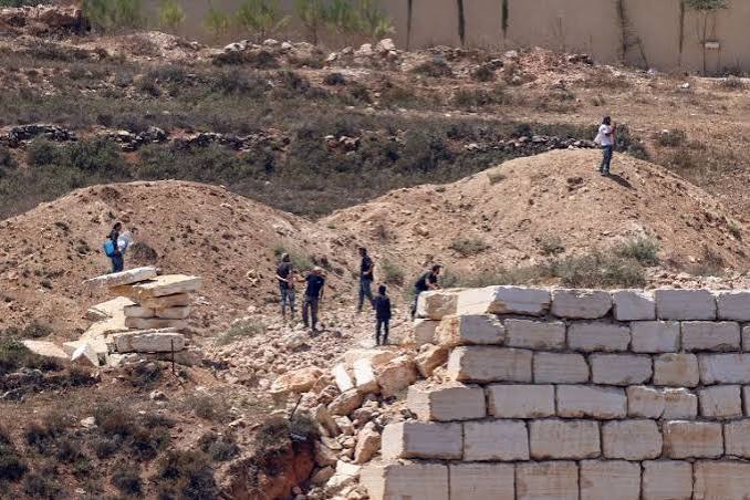 Israeli settlers gathered in the West Bank near the Palestinian village of Qusra.