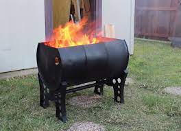 Safe for use on wooden deck: Diyer Upcycles Old Drum Into Functional Scrap Wood Burning Pit