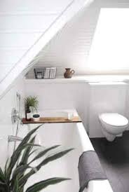 This is a great hack for adding height to an attic room. Working With Sloped Ceilings In The Bathroom Mecc