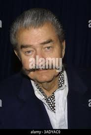 Artist Leroy Neiman and New York Jets former QB Joe Namath (right) check  and sign each of the 350 limited edition serigraphs