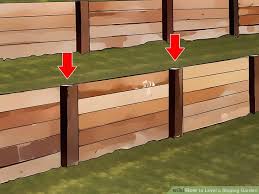 How To Level A Sloping Garden In 2020 Sloped Garden Sloped Backyard Back Garden Landscaping