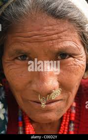 Nepal, Sauraha. Nepali woman in harvested field. (Editorial Use Only Stock  Photo