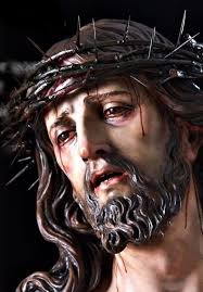 Jesus, Who in Your bitter Passion, became the reproach of men and the Man  of Sorrows, I venerate Your Holy Face