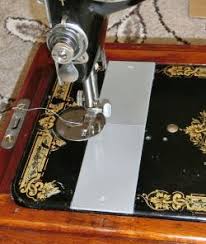 A 'k' between the class number and variety (or sub model) number, e.g. Singer Sewing Machine Models Stlfinder