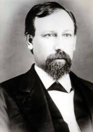 Doc Hisom working leather in front of his house. William C. “Doc” Hisom  arrived in Idaho around 1885, or 1890, or maybe as late as 1897. In the  1900 census he was