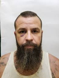 Four men, including a Canadian national charged for Hopkins mass shooting