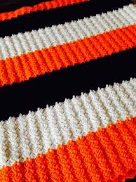 Black And White Crochet Baby Blanket Pattern Slanty Shell Crochet Blanket In Orange White And Black Knitted Blankets Crochet Yarn Color Combinations