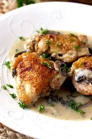 Creamy Chicken And Mushrooms On A White Plate Garnished With Chopped Parsley Chicken Thigh Recipes Crockpot Oven Roasted Chicken Thighs Best Chicken Recipes