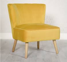 Whether you need a spot to curl up with a good book or somewhere to lay out clothes for the next day, this streamlined barrel chair is a versatile addition to your space. Louise Yellow Velvet Compact Lounge Chair Bedroom Chair