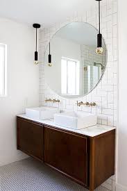 Round wall mirror with pivoting exposed brackets. My Favorite Round Mirrors Interior Designer Des Moines Jillian Lare