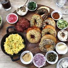 Momofuku Daishō Bagel Feast Platter Toasted Bagels Breakfast Sausage Smoked Fish Mousse Scrambled Eggs Gree Breakfast Platter Food Platters Fish Salad