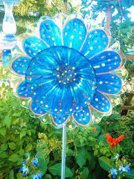 Funky Yard Art For Your Garden Glass Flowers Made Out Of Recycled Materials Such As Plates Cups Garden Art Crafts Art Glass Flowers Glass Garden Flowers