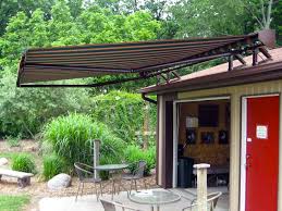 The awning has 3 retractable arms and is roof mounted with 5 heavy duty aluminum roof brackets. Retractable Awnings Heartland Awning Design