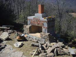 The fireplace, a narrow strip 5 inches wide also was cut into the wood floor, directly above the basement foundation wall. How To Build An Outdoor Rock Fireplace New Fireplaces Trends Design Ideasnew Firepla Diy Outdoor Fireplace Outdoor Fireplace Plans Outdoor Stone Fireplaces