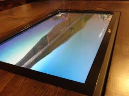 The first of its kind, this monster sized tablet allows you to simultaneously run android and window 8 systems for maximum versatility and utility. Coffee Table With Built In Touch Screen Touch Screen Design Screen Design Touch Screen