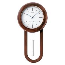 This timeless dark brown oak schoolhouse wall clock is classically sophisticated. Circular Sleek Wall Clock W Pendulum And Dual Chimes 12 X 23 X 5 Walmart Com Walmart Com