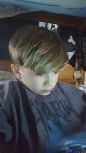 A punk short hairstyle where the hair is styled to the side, straight and sleek. Boys Haircut Long In Front Short Sides And Back Boys Haircuts Boy Haircuts Long Little Boy Hairstyles