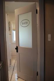 With plenty of white to go around, the door adds welcome contrast. A Basement Remodel Is A Great Idea To Add Value To Your Home And Equity Check Out These Images Of Glass Bathroom Door Vintage Modern Bathroom Room Door Design
