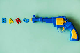 Flare gun, also known as signal gun, is a large diameter gun that emits a flare. Hd Wallpaper Blue And Yellow Plastic Revolver Gun Toy On Top Green Surface Wallpaper Flare