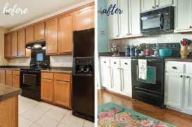 Here is how our kitchen looked after painting the cabinets and adding glass to one set of them: Update On Our Diy White Painted Kitchen Cabinets 2 Years Later