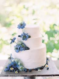 Simple Wedding Cake Design With Fresh Blueberries And Blue Nigella Flowers Cake Blo Wedding Cake Flowers Blue Wedding Cake Simple Elegant Simple Wedding Cake