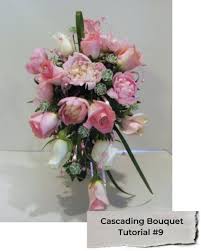 A large cascading bouquet made from home using artificial flowers and a net. Cascading Wedding Bouquets Diy Bridal Bouquet Tutorials