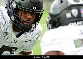 October 23, 2021 Oregon Ducks running back Travis Dye #26 catches a pass  and is tackled by UCLA Bruins defensive back Devin Kirkwood #26 and UCLA  Bruins defensive back Quentin Lake #37