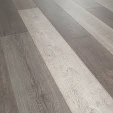 Helvetic Floors Water Resistant Zermatt Oak 12mm Thick Laminate Flooring 14 33 Sq Ft Case Hv05 Laminate Flooring Flooring Oak Laminate Flooring