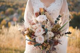 To make a bridal bouquet, choose the color theme and flowers, remove all greenery from the flowers, start with the largest bloom in the center and spiral. The 8 Best Fall Wedding Flowers For The Season According To Experts Weddingwire
