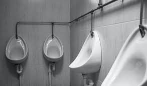 white ceramic urinal sinks