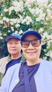 Walking through white flowers in California