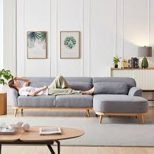 Coffee table/ottoman features a buttoned espresso linen upholstered top. ValyÅu Furniture