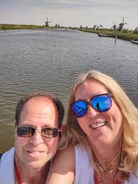 Kinderjik (The Netherlands) windmills! Last night's sunset while  dining/cruising towards Amsterdam & this mornings moon rising over  buildings in Amsterdam!