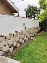 While there's the standard design that looks like a square figure 8, there are actually many different cinder block designs, shapes and sizes. Cinder Block Succulent Wall In 2020 Cinder Block Garden Wall Cinder Block Garden Cinder Blocks Diy