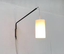 This rotating wall lamp perfectly combines style and function. Mid Century German Minimalist Cantilever Wall Lamp From Erco For Sale At Pamono