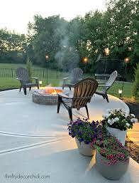 The idea of sitting outside and enjoying an open flame is hard to resist. Our Cozy Round Patio Fire Pit With New Chairs Thrifty Decor Chick